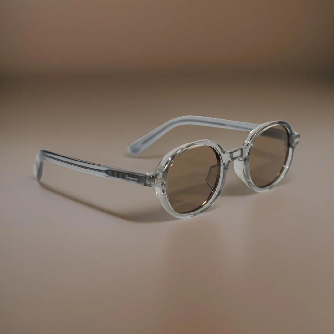 Close-Up of First Lens Retro Round Brown-Tinted Sunglasses on a Rock