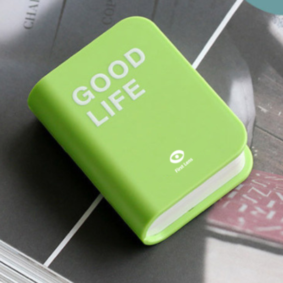 A creative and functional contact lens container shaped like a book, offering a convenient solution for lens storage.