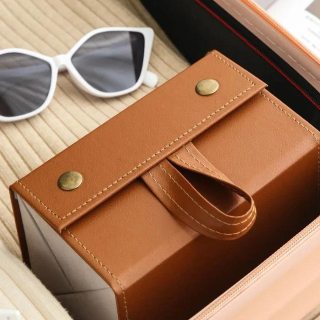 Sunglasses being placed into the compartments of the First Lens Locker for safekeeping.