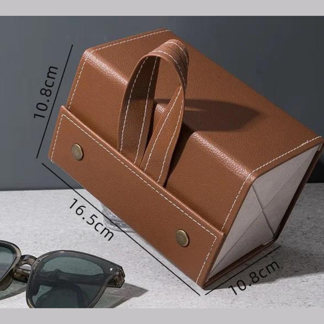 A person holding the First Lens Locker, demonstrating its compact size and portability.