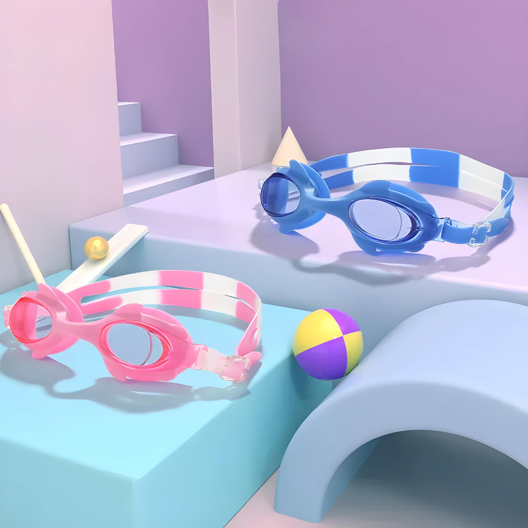 A child wearing blue swimming goggles with the First Lens logo on the strap.