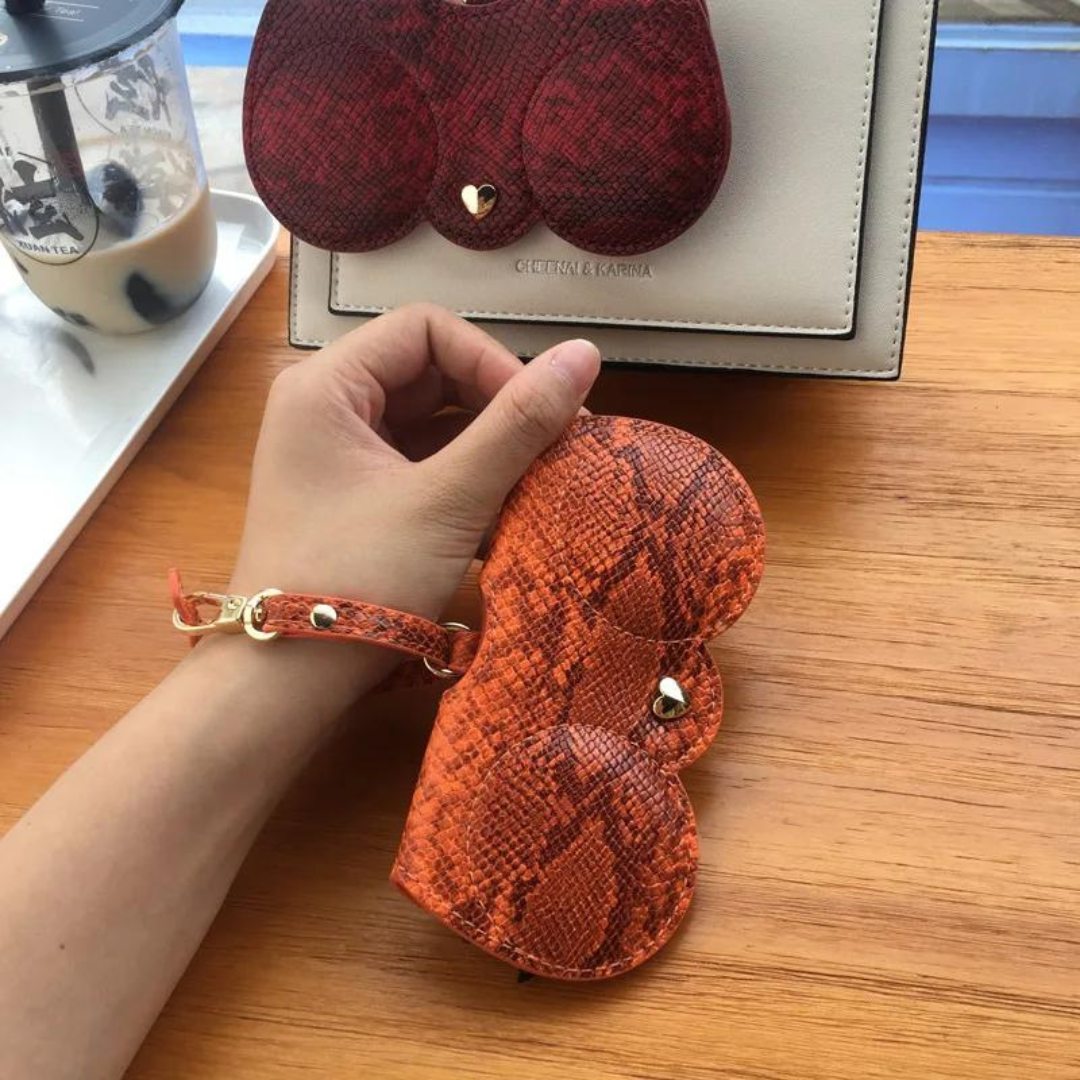 A side view of the First Lens glasses case, showcasing its compact design.
