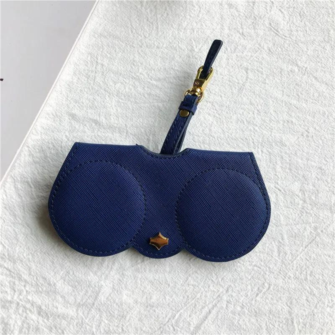 A close-up of the clip mechanism on the First Lens eyeglasses case, showing its functionality.