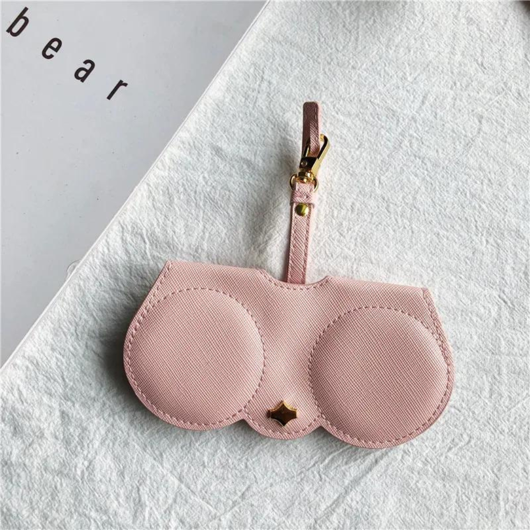The First Lens eyeglasses case open, revealing multiple compartments for sunglasses and regular glasses.