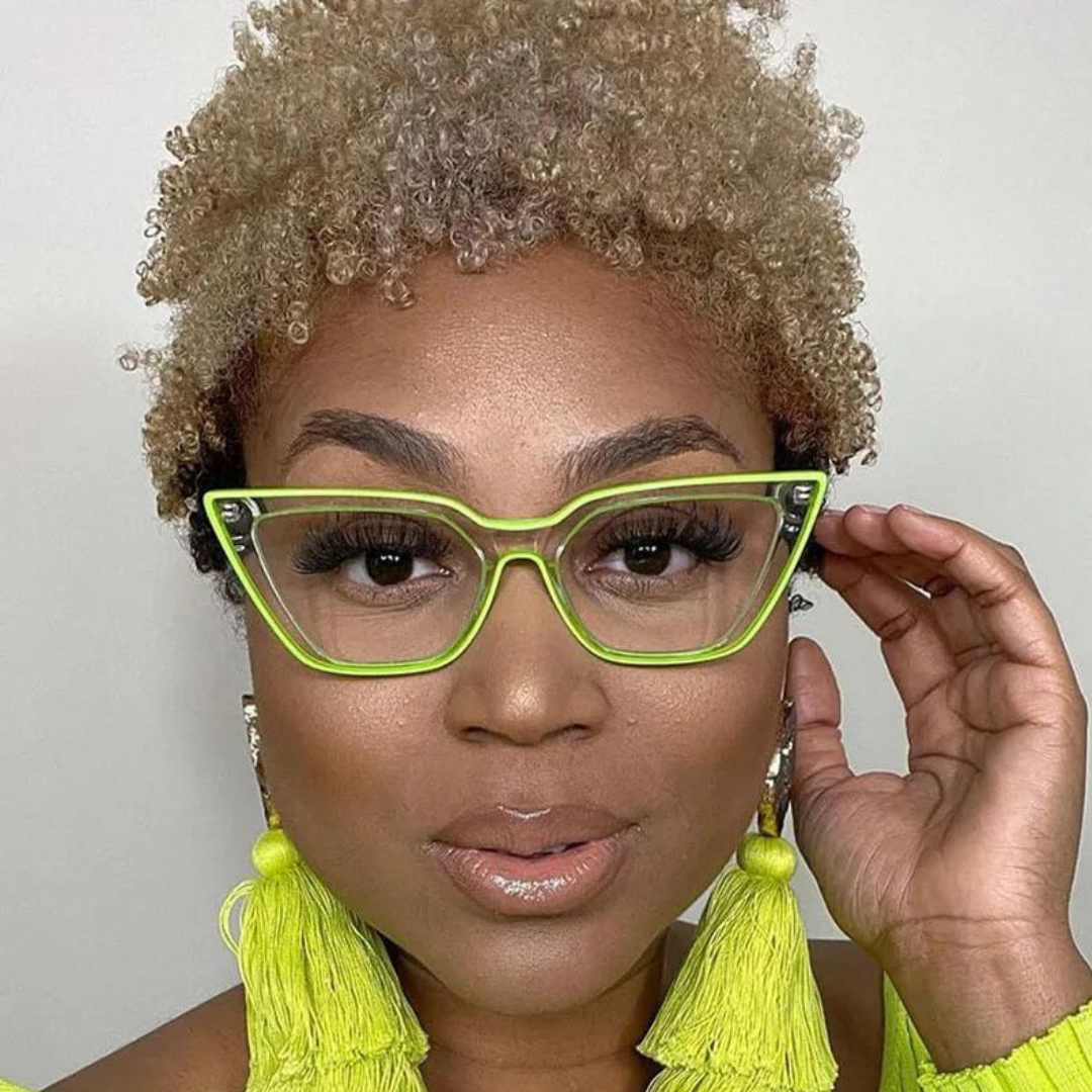 Pair of cat eye computer glasses with a neon green hue, ideal for adding a pop of color to any outfit.