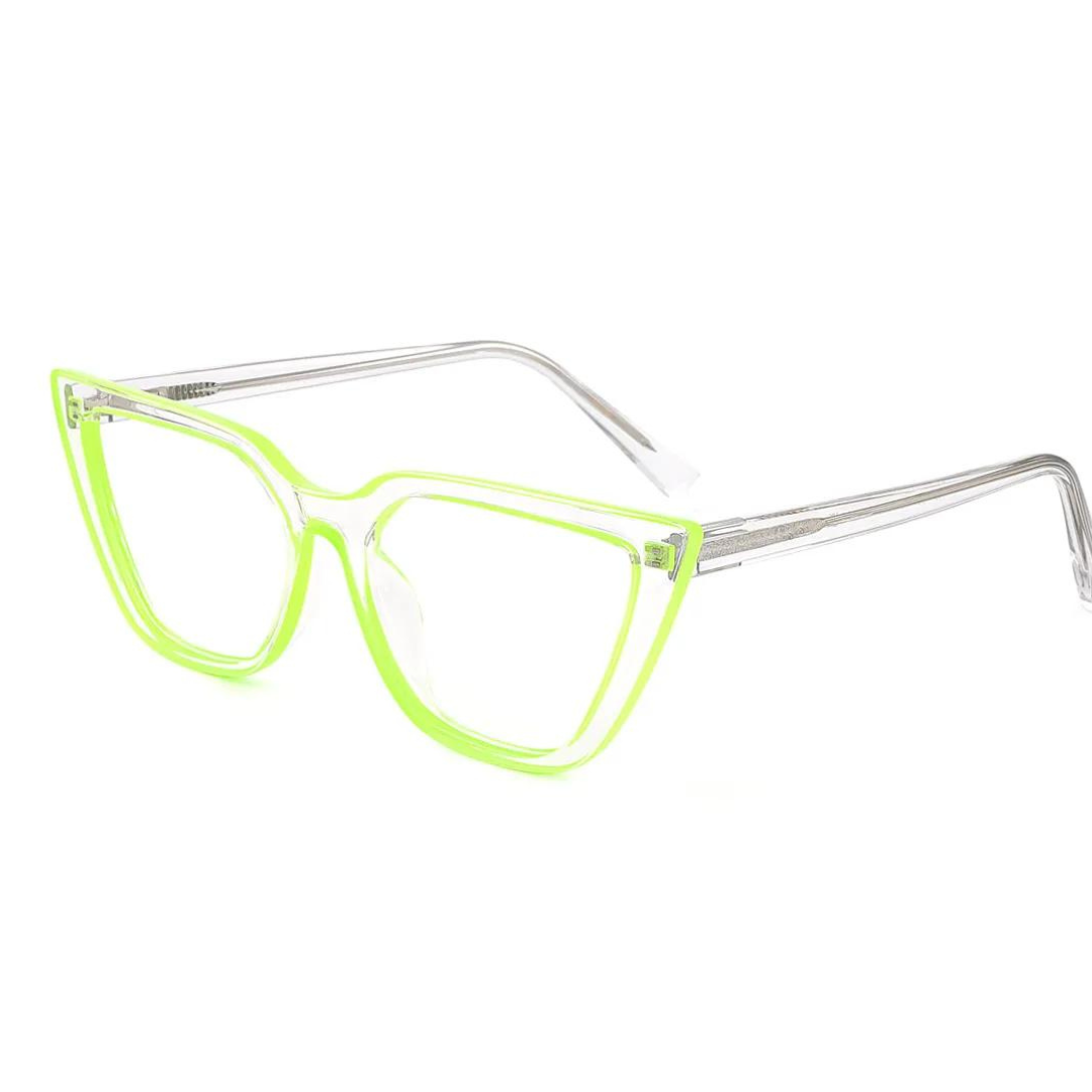 Neon green cat eye computer glasses resting on a white surface.