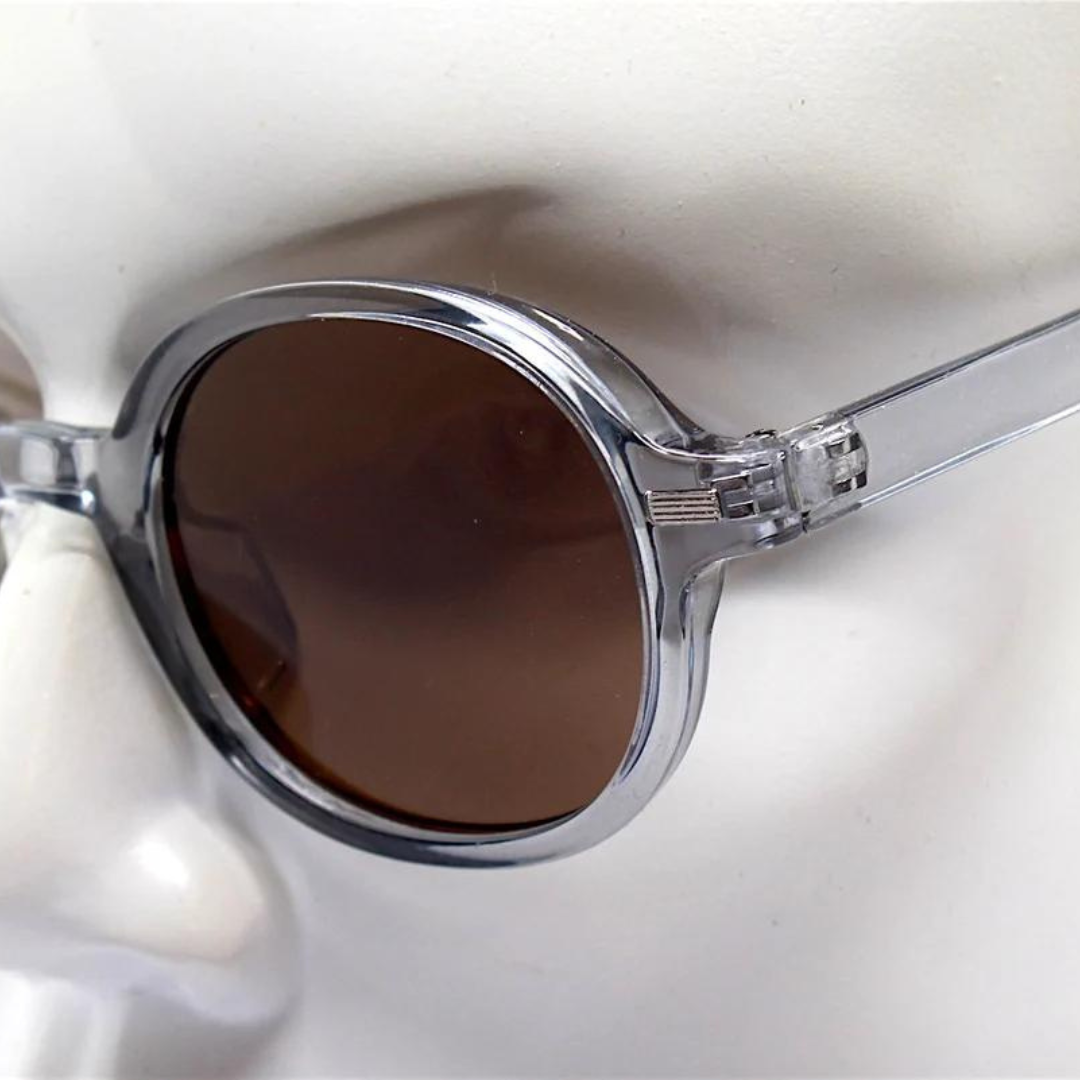 First Lens Retro Round Brown-Tinted Sunglasses Displaying Elegant Curves