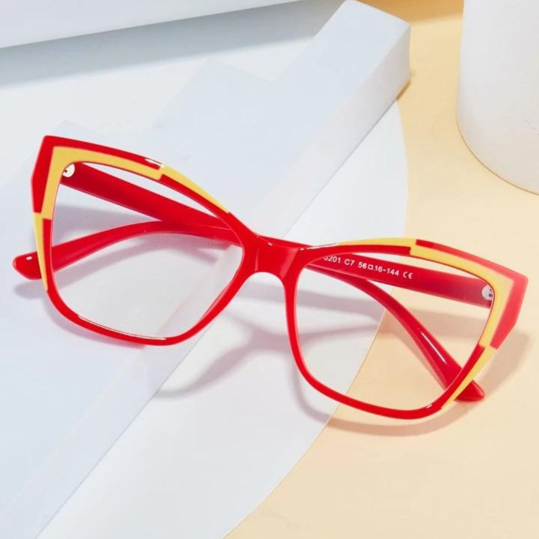 Close-up of First Lens Vibrant Red Cat Eye Computer Glasses on a white surface