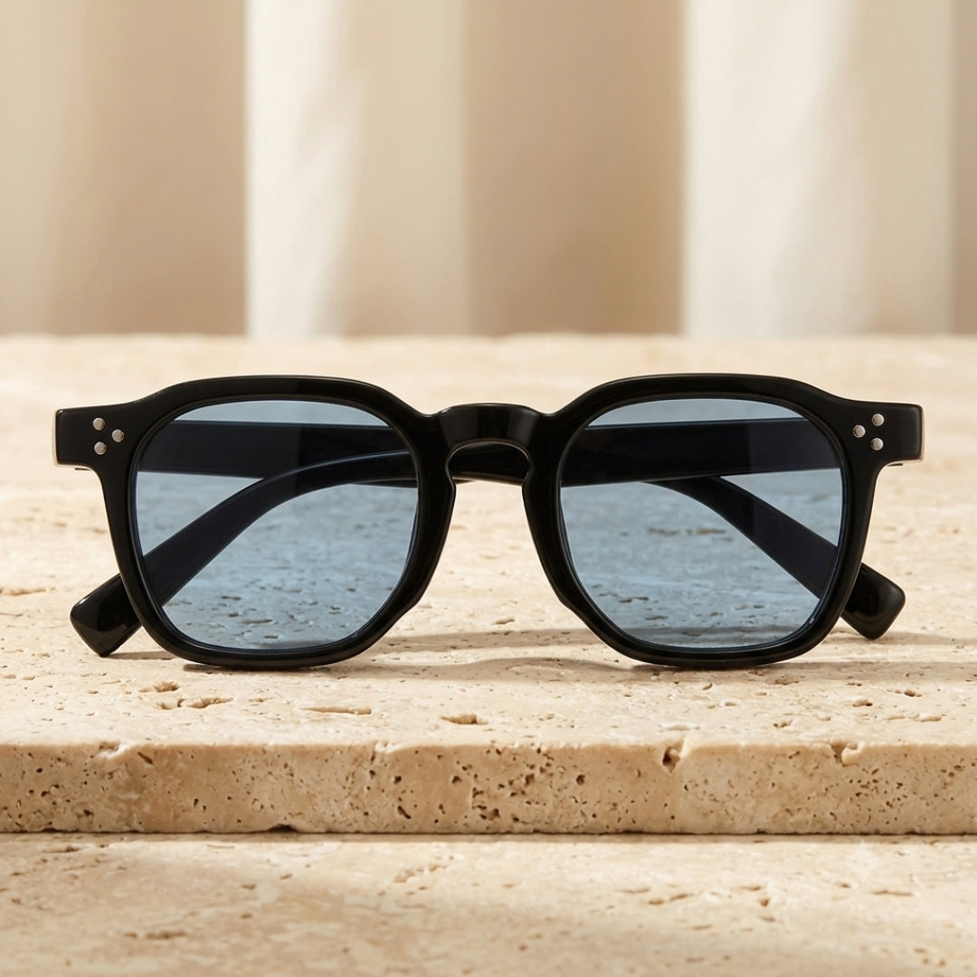Black Hexagonal Sunglasses on Stone Pedestal