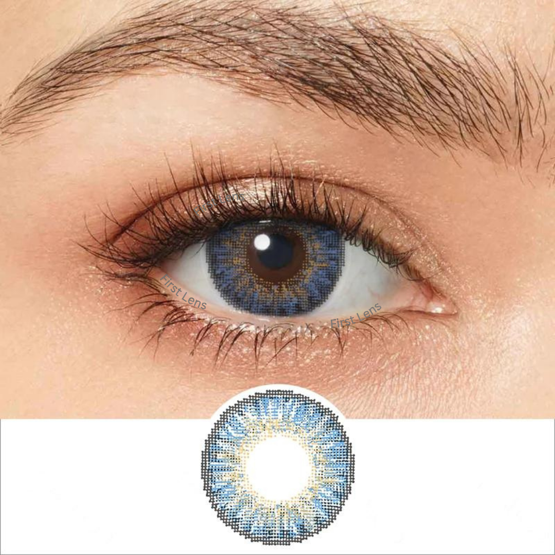 A close-up image of a single Dream Blue color contact lens by First Lens in its packaging.