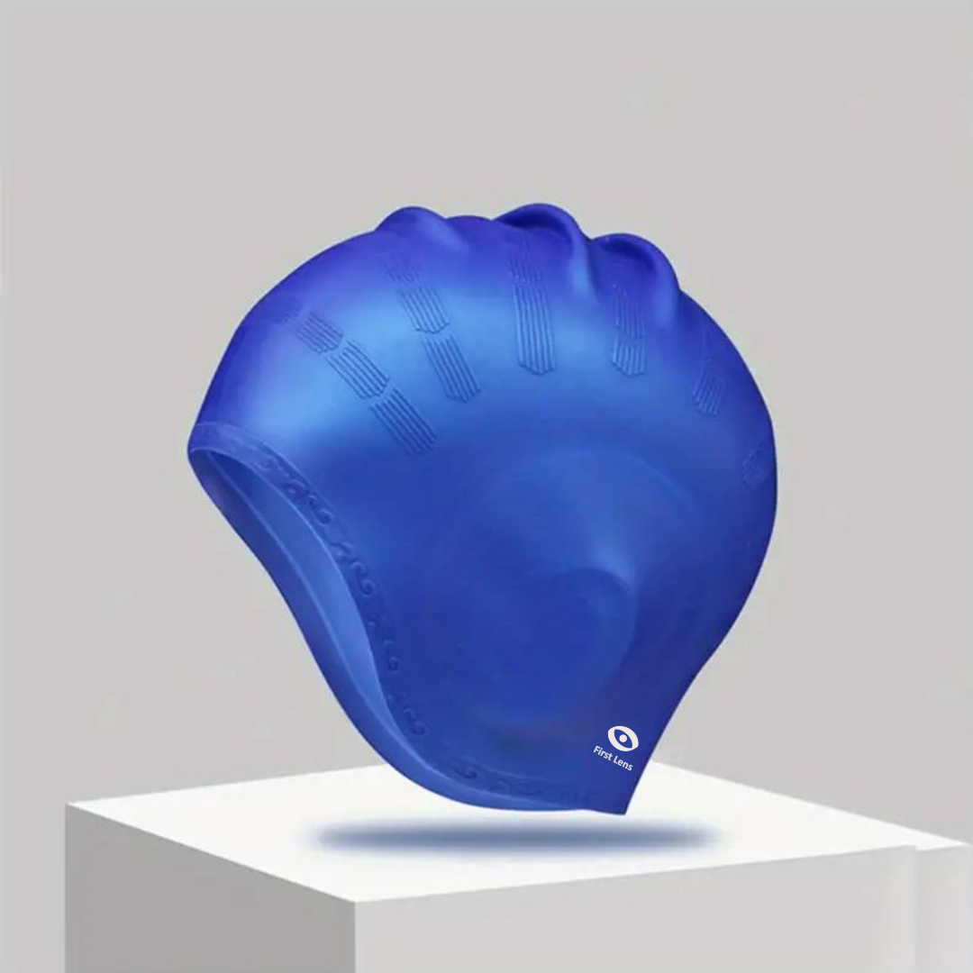 Adult wearing a First Lens Swimming Cap with a sleek and modern design.