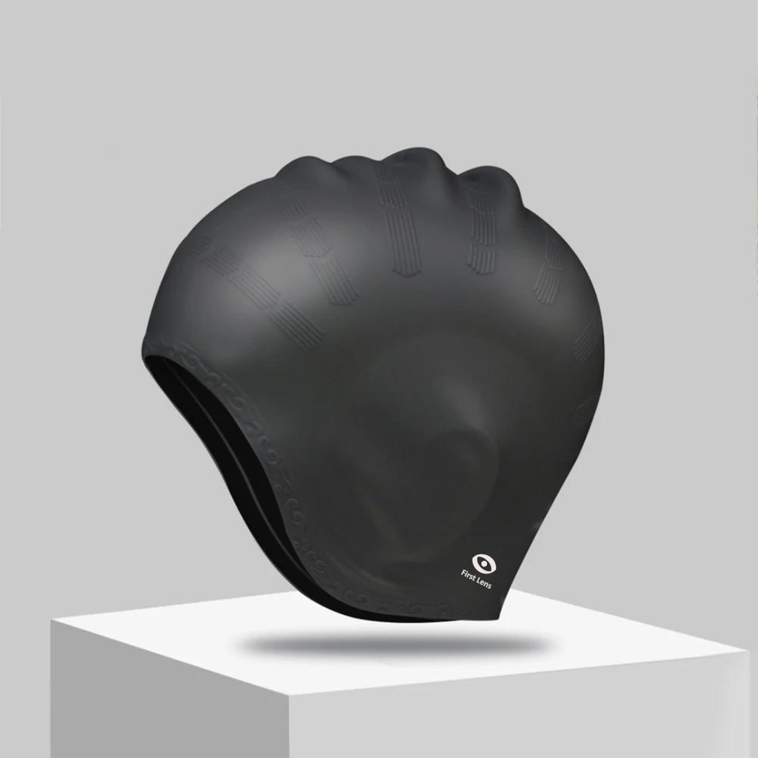 Black silicone swimming cap for adults by First Lens with a minimalist look.