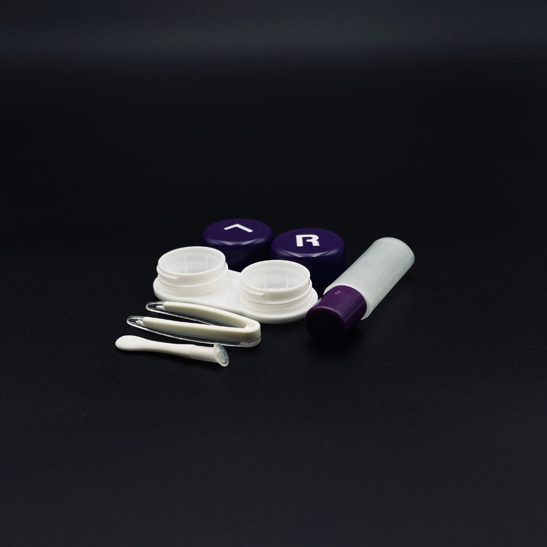 A cute pear-shaped contact lens case by First Lens, great for keeping your lenses organized.