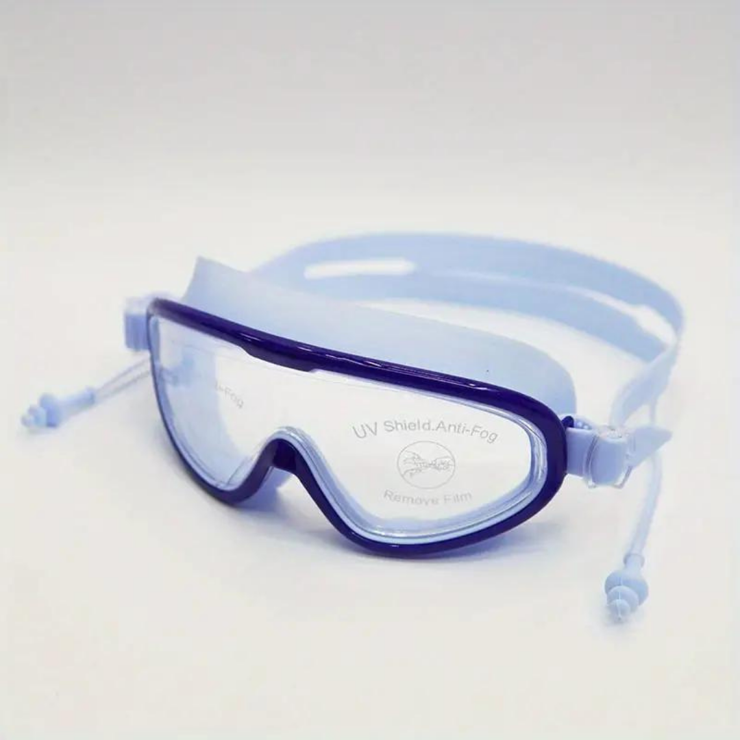 First Lens kids goggles placed on a shelf alongside other swim gear.