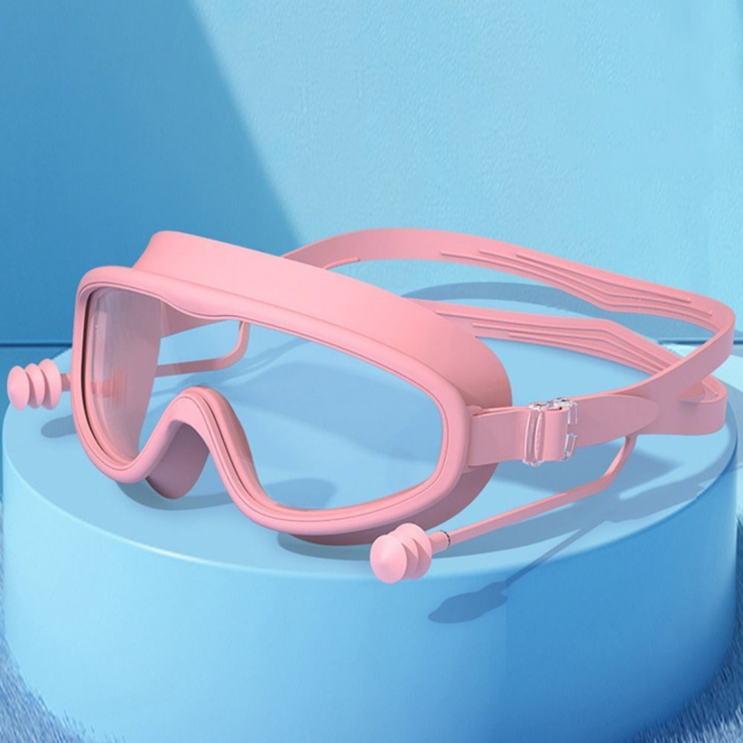A child wearing First Lens kids goggles while swimming in a pool.