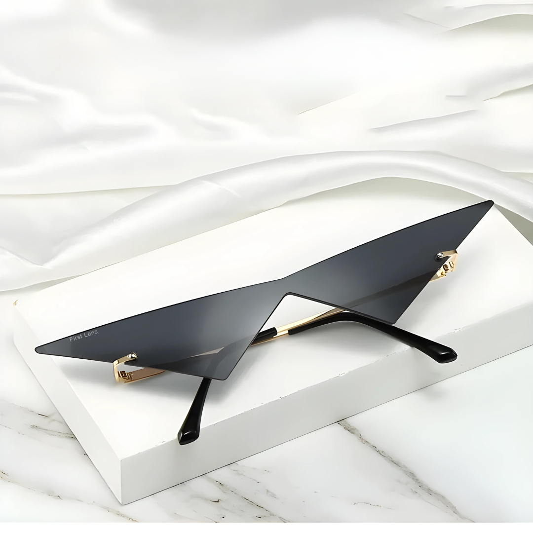 First Lens Black triangular sunglasses with oversized lenses.