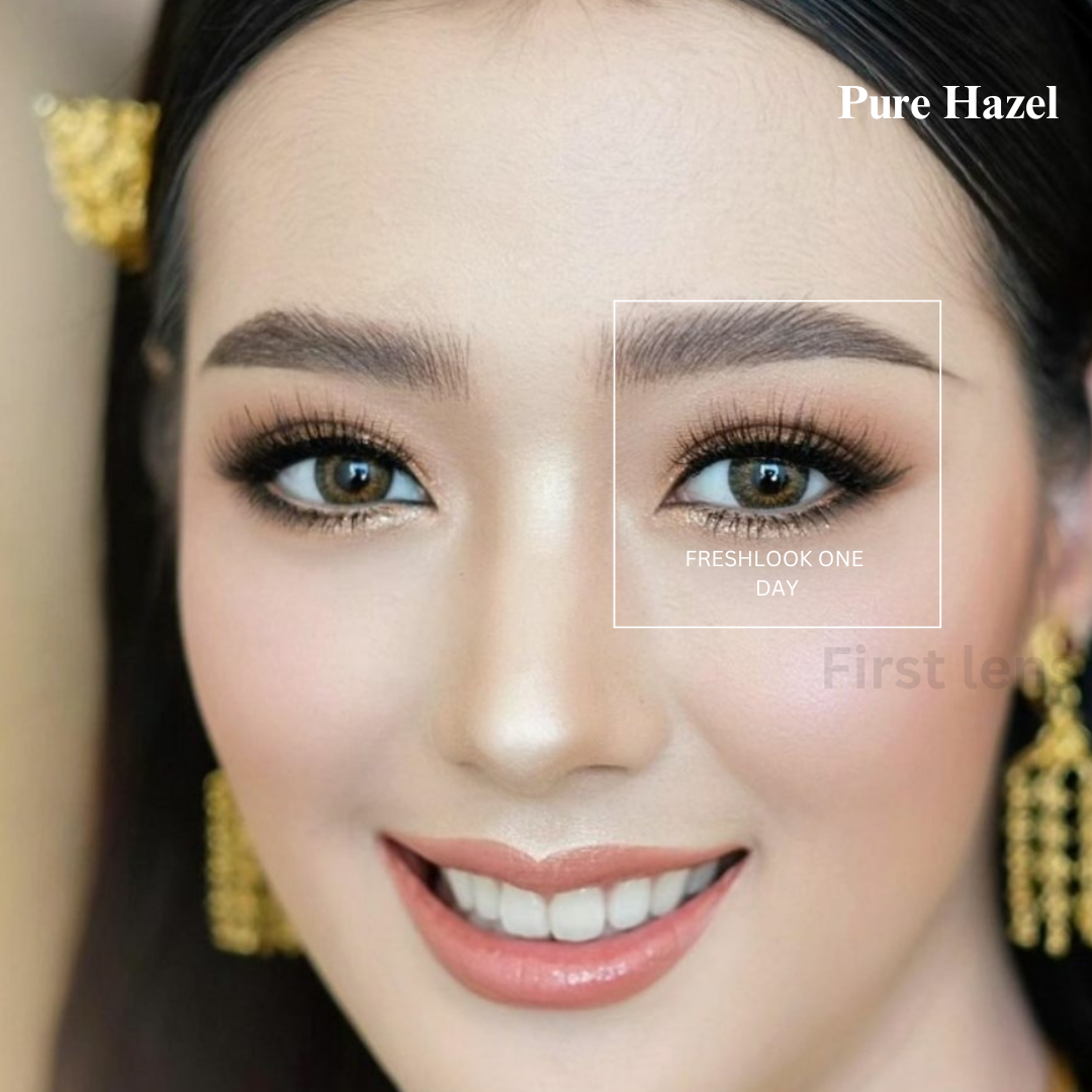 A person with hazel eyes, wearing Alcon Freshlook OneDay Color Lenses in a slightly different shade of hazel.