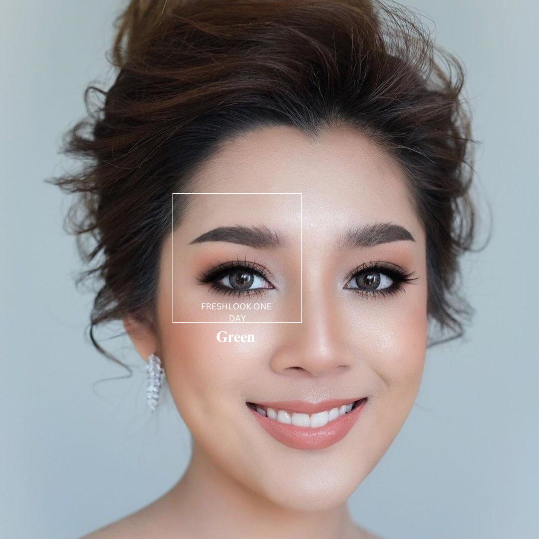 A close-up image of a person's eyes wearing the First Lens Alcon Freshlook OneDay Color Lenses in Hazel, with the person smiling and looking off into the distance.